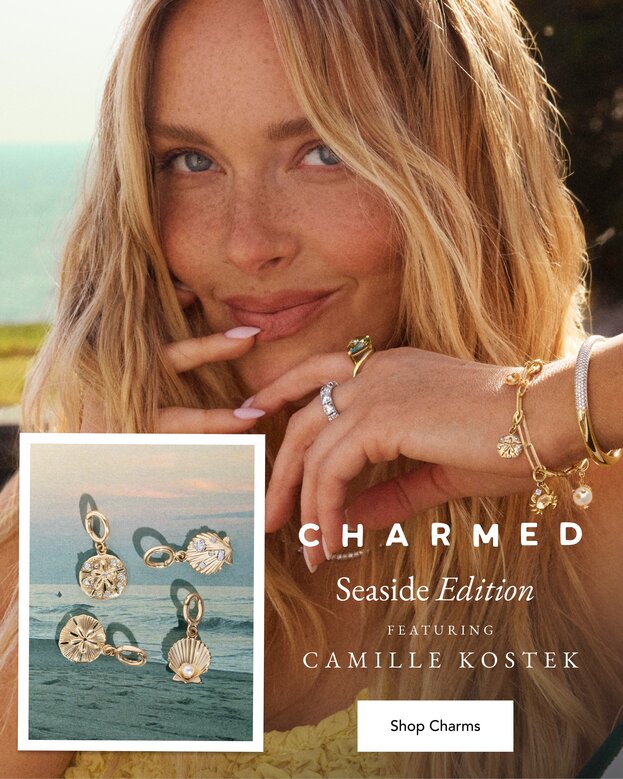 Camille Kostek wearing a gold charm bracelet perfect for Summer.