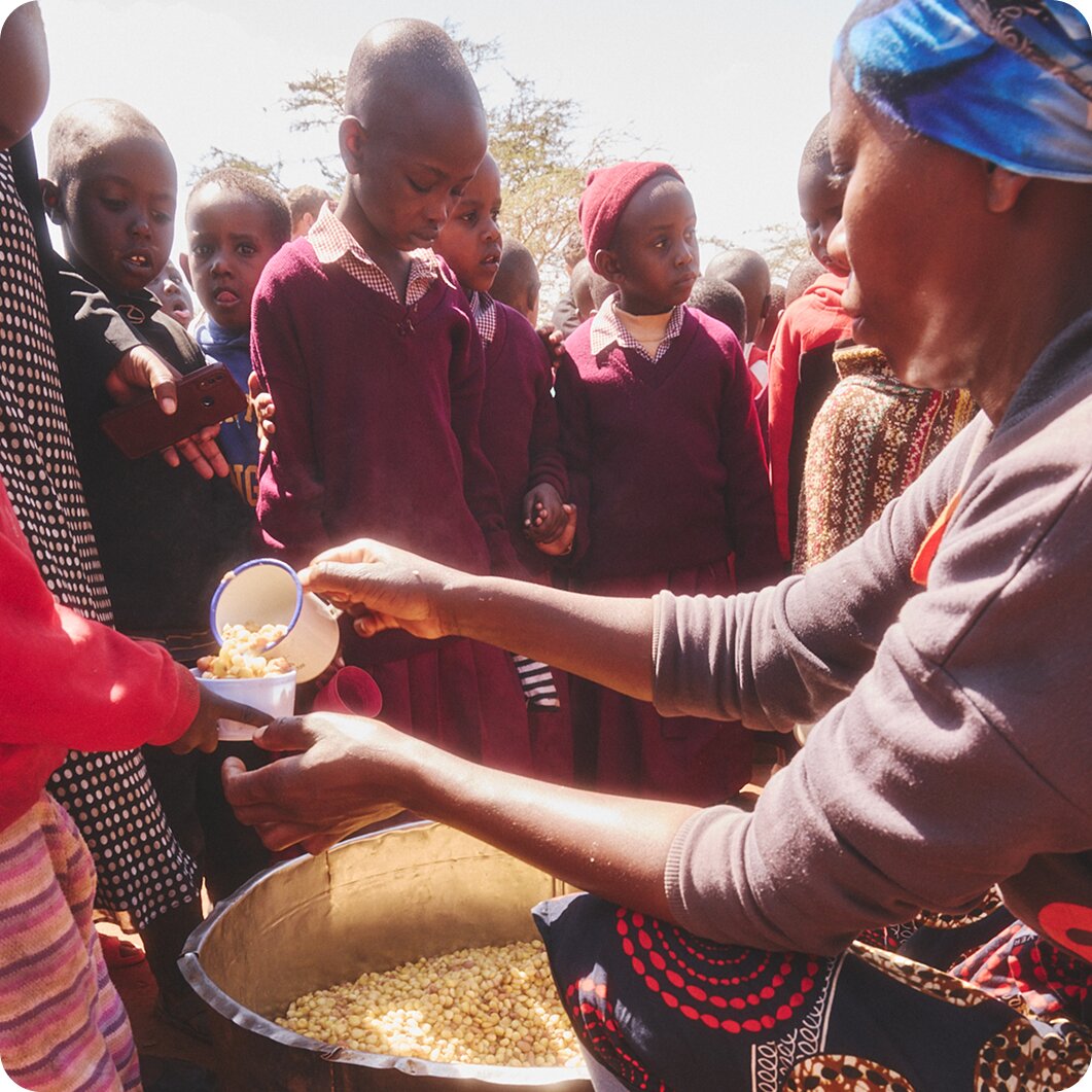 Close-up of hands sorting loose gemstones on paper