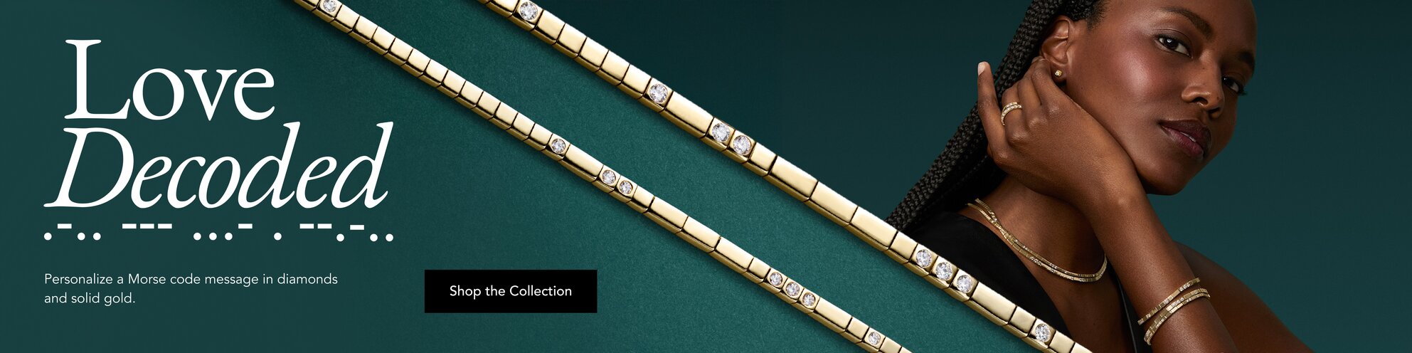 Model wearing an assortment of jewelry from the Love Decoded Collection