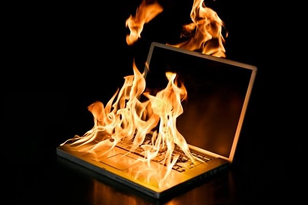 An image of a burning laptop.