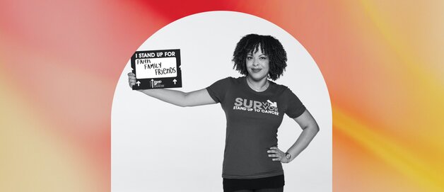 A young woman holding up a poster about equal rights