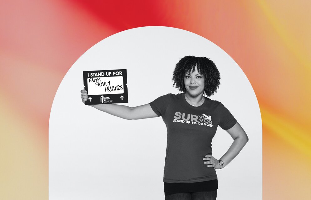 A young woman holding up a poster about equal rights