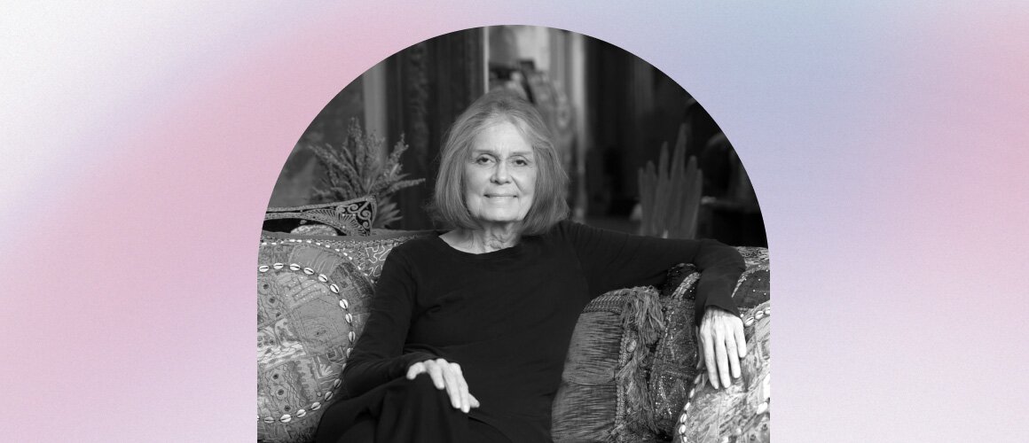 Gloria Steinem sitting on a couch