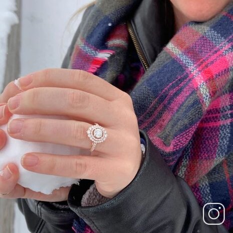 A woman wearing a diamond engagement ring