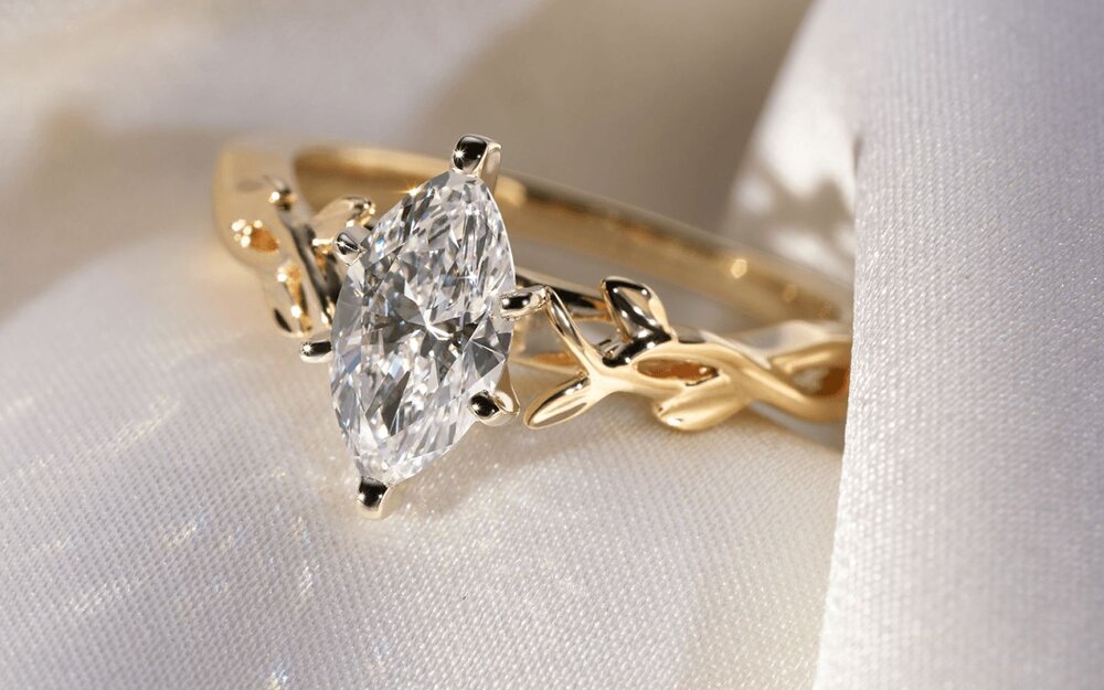 A diamond engagement ring surrounded by fabric