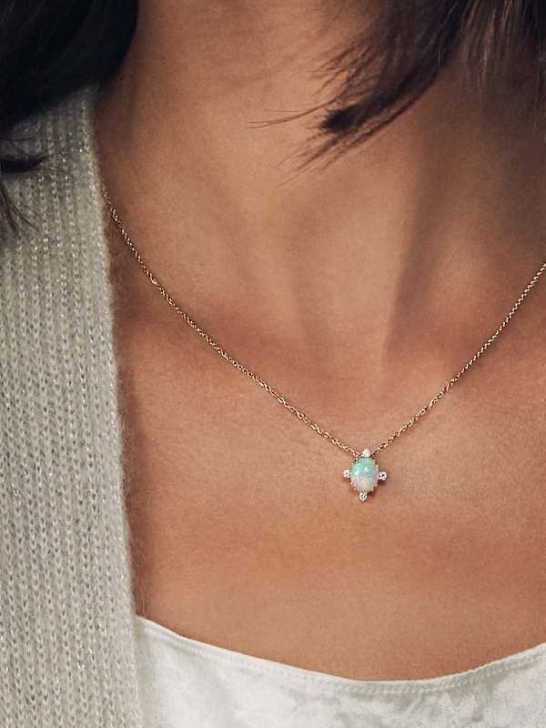 A woman wearing a fashion opal necklace