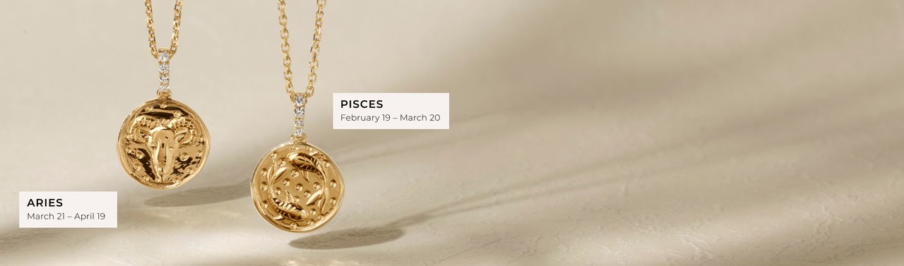 An Aries and a Pisces zodiac pendant