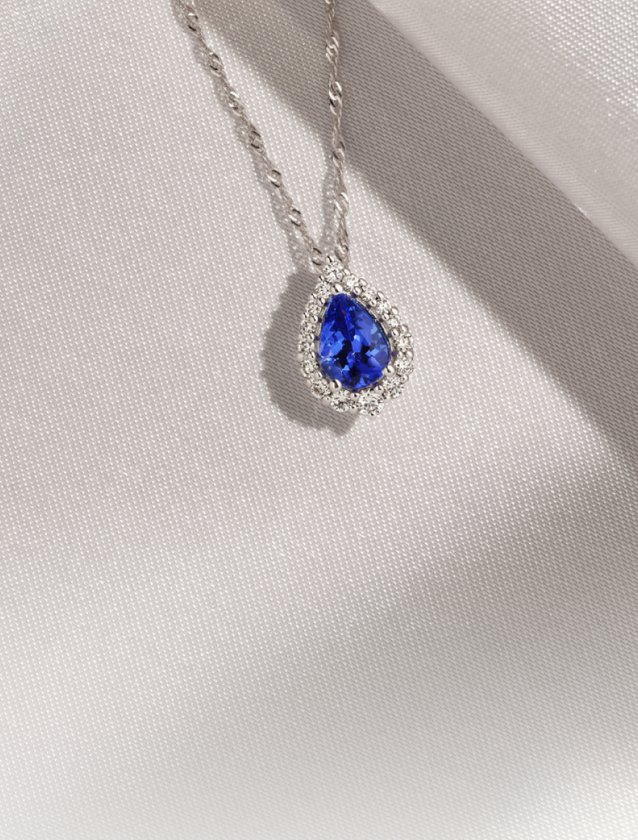 A tanzanite and diamond fashion pendant