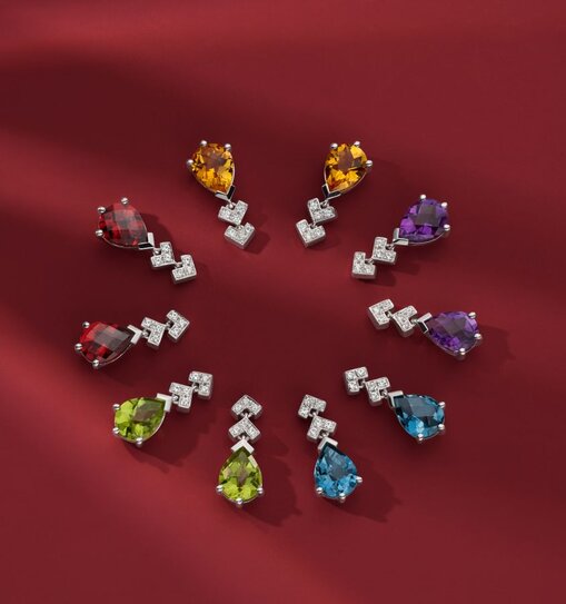 A collection of colored gemstone earrings