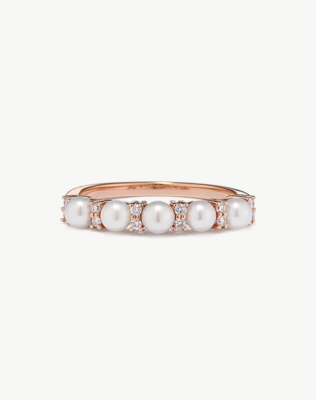 A diamond and pearl fashion ring