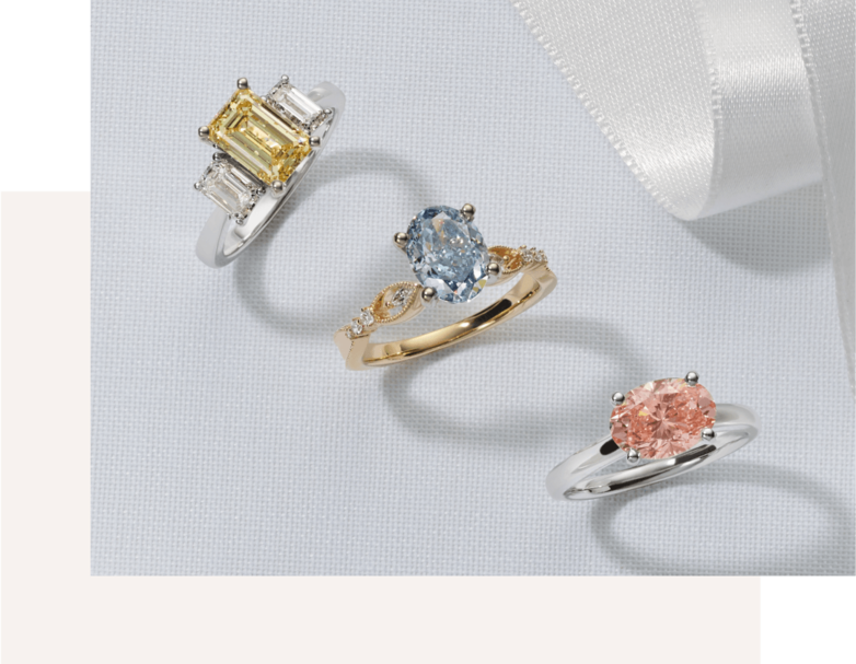 Three engagement rings with fancy color lab-grown diamonds for center stones