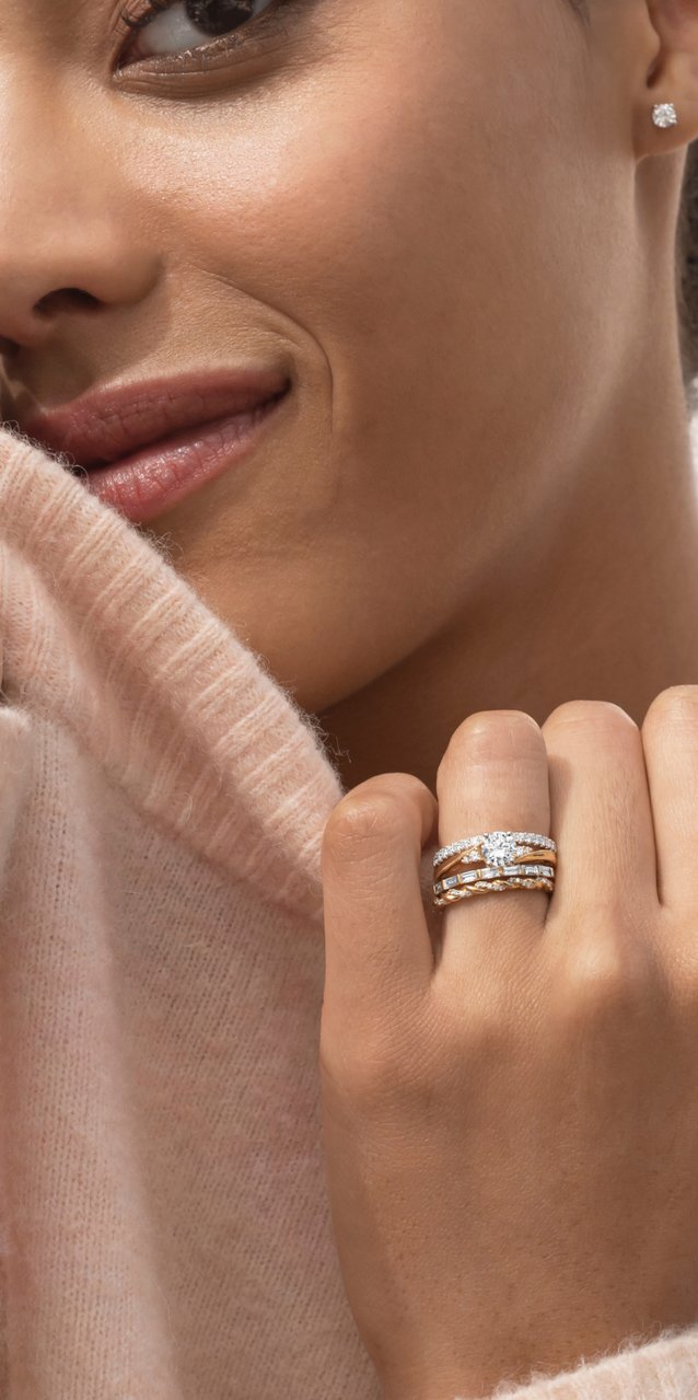 A woman wearing stacked wedding bands