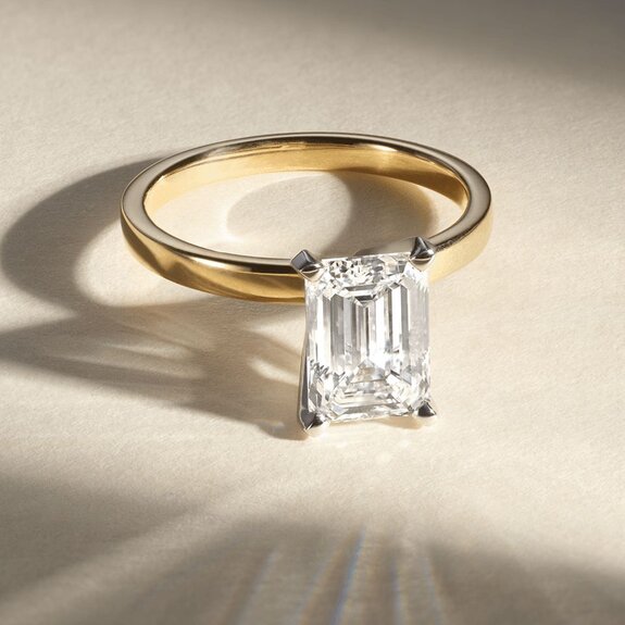 Three diamond engagement rings with different shaped center stone diamonds