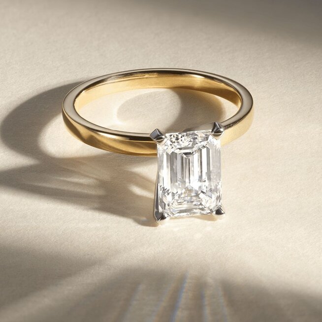 Three diamond engagement rings with different shaped center stone diamonds