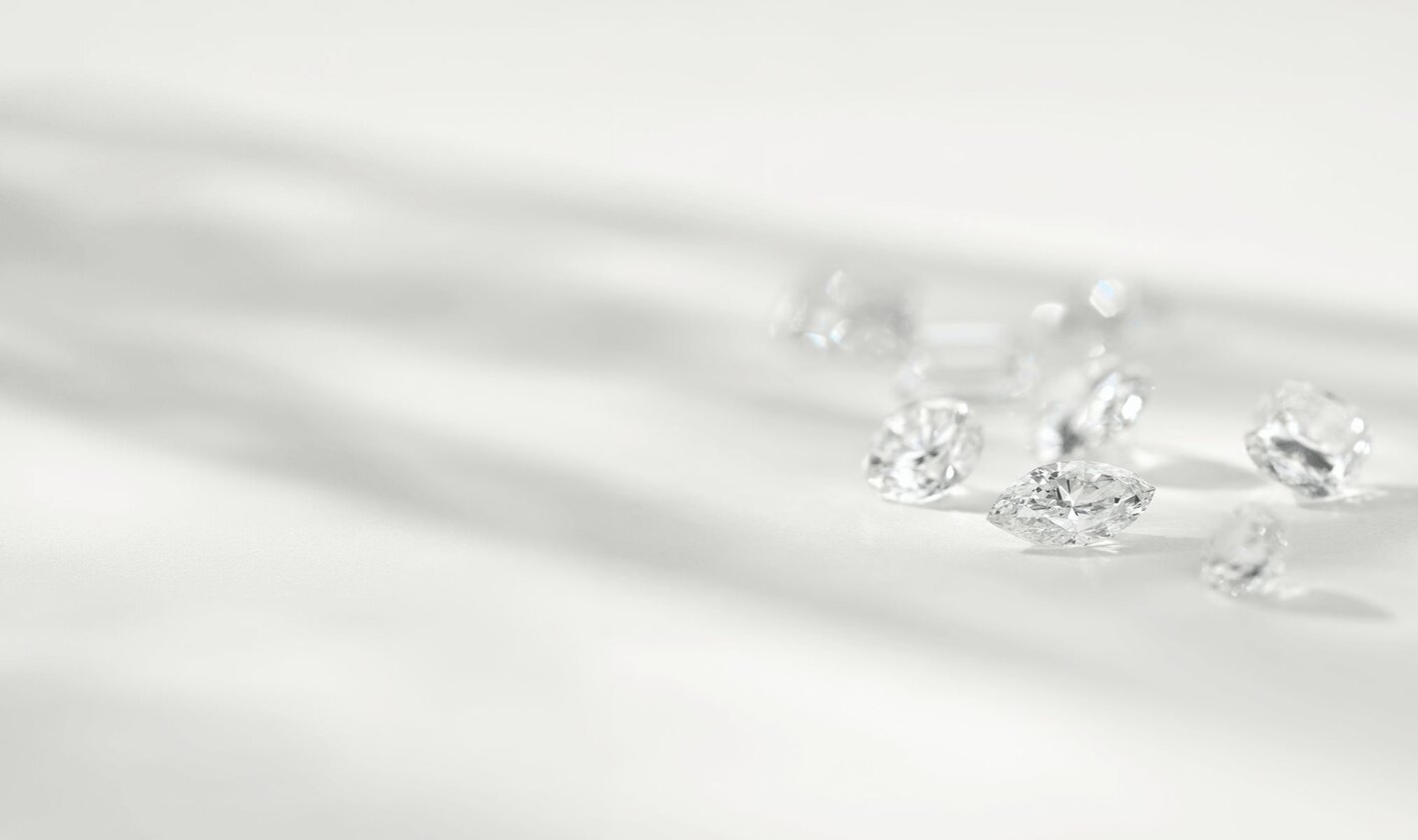 A collection of different shaped diamonds on a white background.