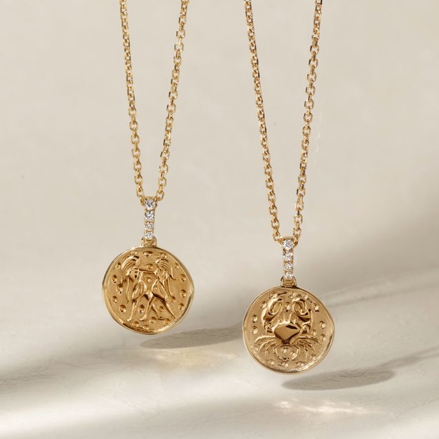 Two zodiac charm pendants
