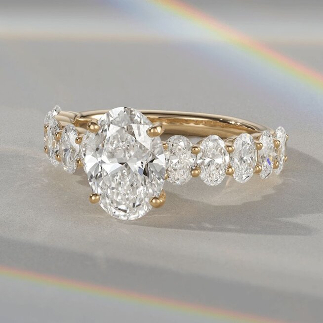 A diamond engagement ring with an oval shaped center diamond