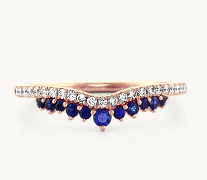 A diamond and traditional blue sapphire contour band