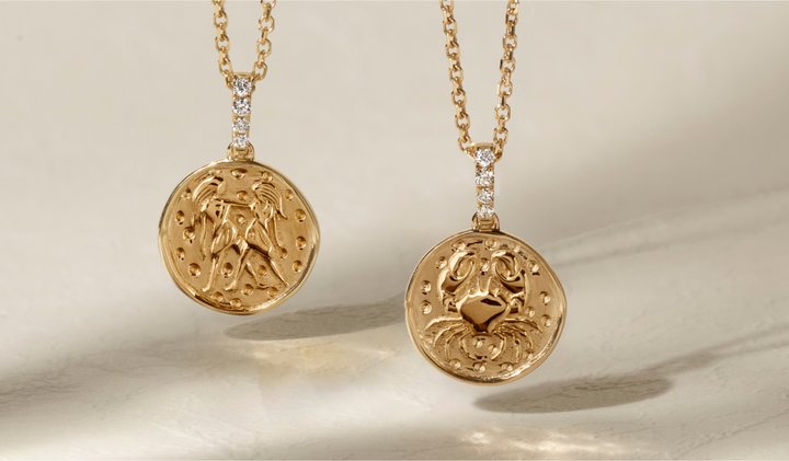 Two zodiac sign pendants