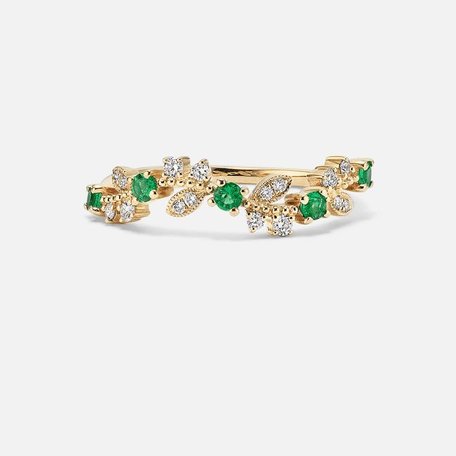 A fashion band with emeralds and diamonds