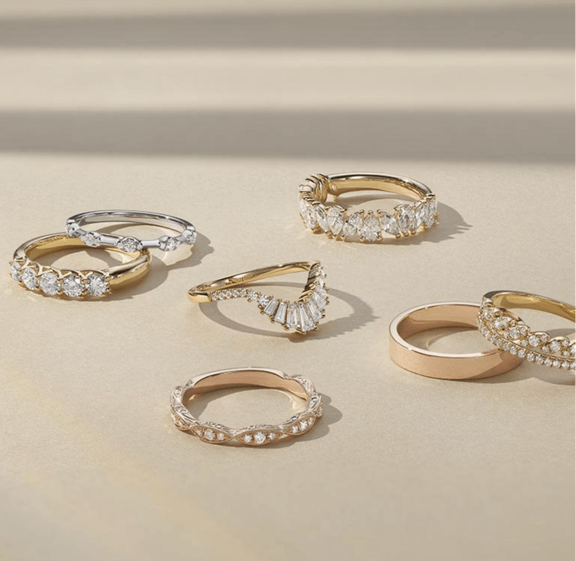 A collection of anniversary rings of various styles.