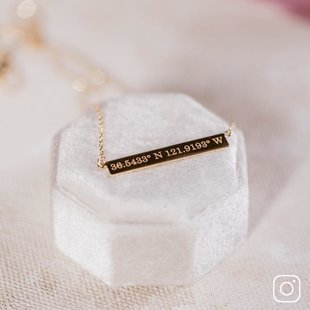 An engraved bar pendant necklace