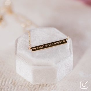 An engraved bar pendant necklace