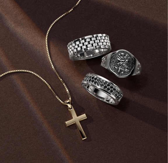 A collection of men's rings and a cross necklace for father's day