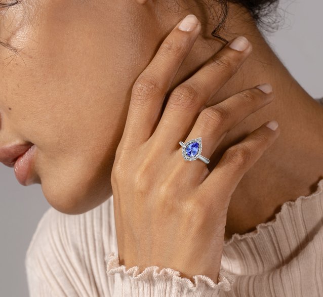 A woman wearing a tanzanite fashion ring
