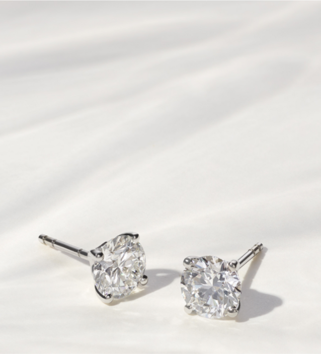 A pair of diamond stud earrings