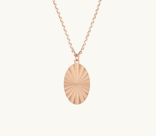 A rose gold oval pendant