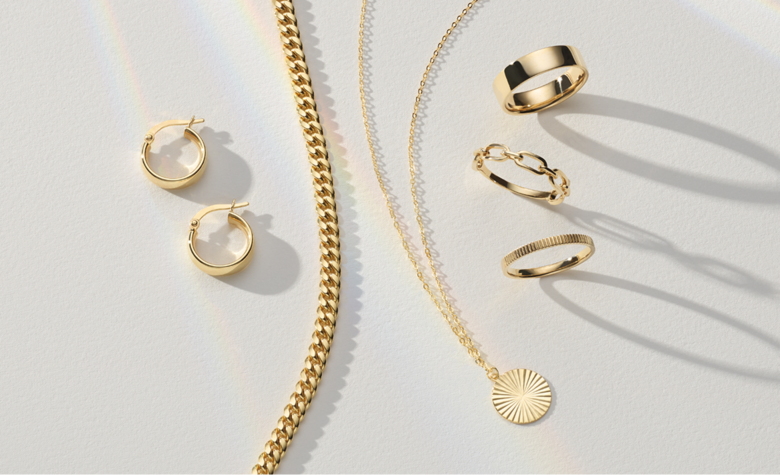 A collection of all gold fashion jewelry