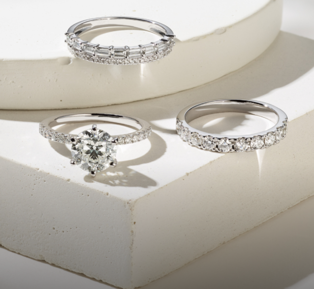 A diamond engagement ring and diamond wedding bands