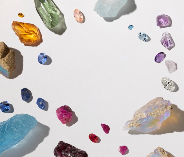 A collection of raw and cut birthstones