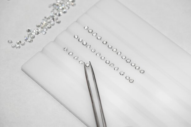 A sorting tray of loose diamonds
