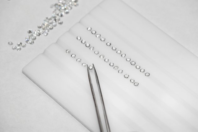 A sorting tray of loose diamonds