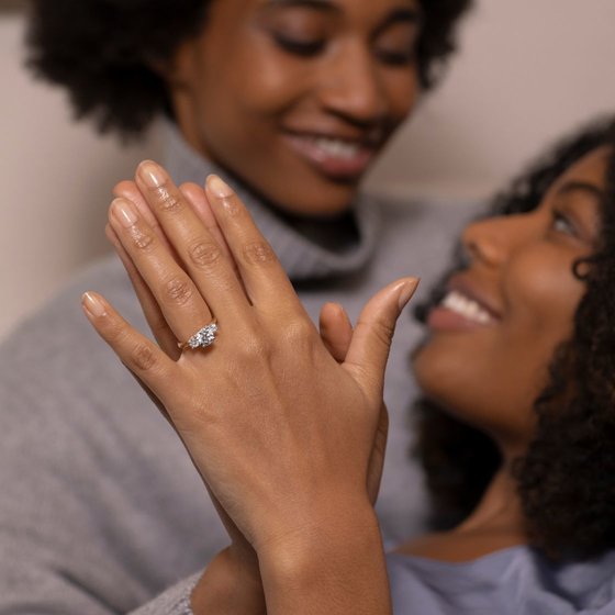Same sex couple with engagement rings