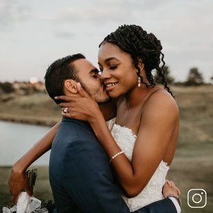 A married couple embracing on their wedding day