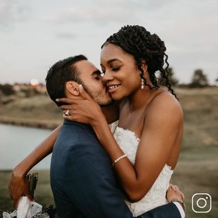 A married couple embracing on their wedding day