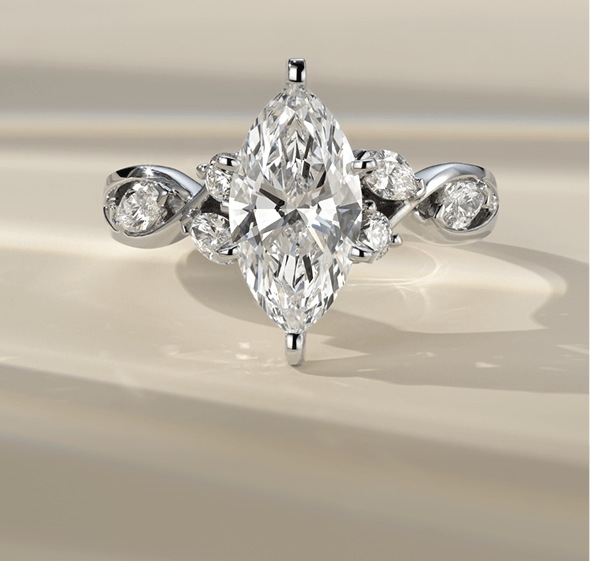 Three diamond engagement rings with different shaped center stones