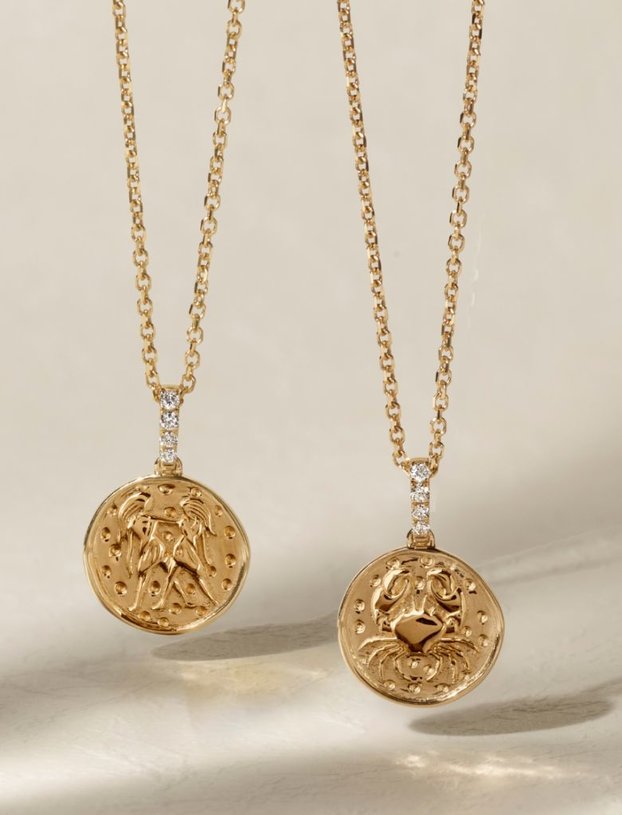 Two zodiac charm pendants