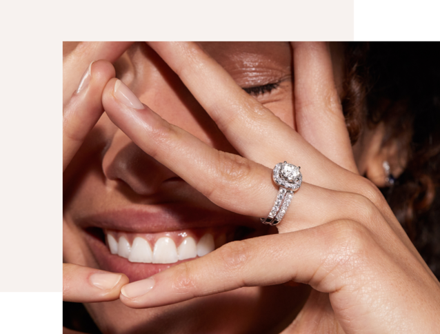 A woman waring a diamond engagement ring set