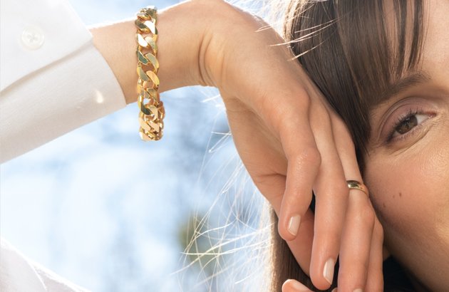 A woman wearing a vermeil bracelet