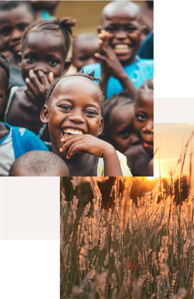 Image of children smiling and a grass field