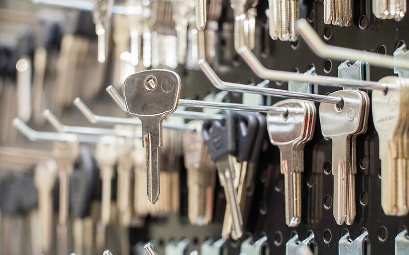 Blank keys hanging on a wall in a shop.