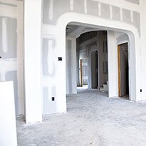 A newly plastered room under construction.