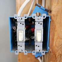 A light switch installed on a stud.