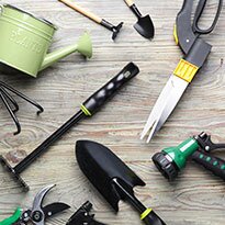 A variety of garden tools laid out.