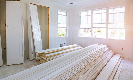 A room under construction with building materials piled up.