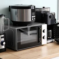 A group of small appliances sitting on a counter.